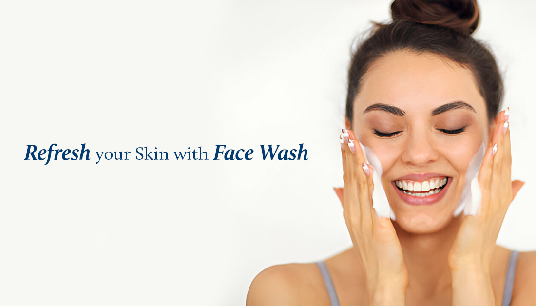 lady is washing her face with face wash